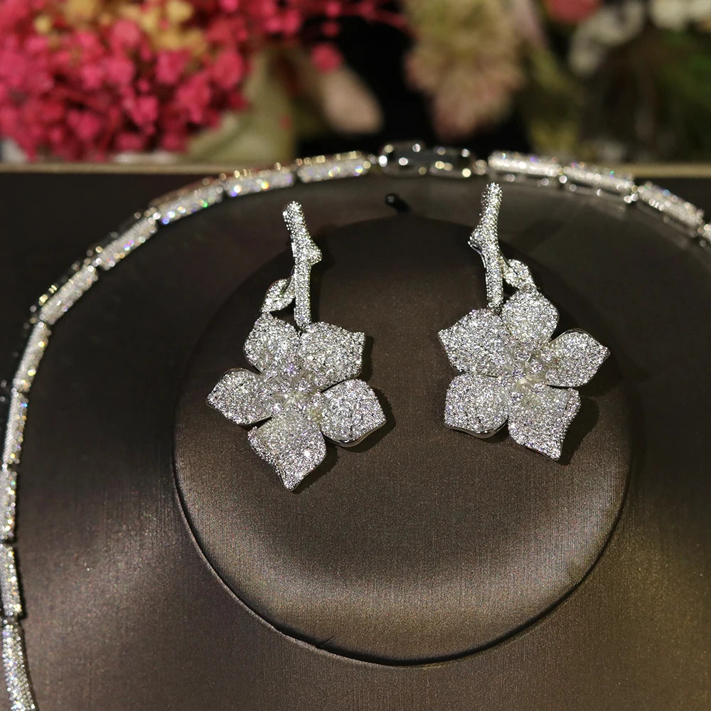 Detailed view of white floral cubic zirconia earrings from a bridal jewelry set