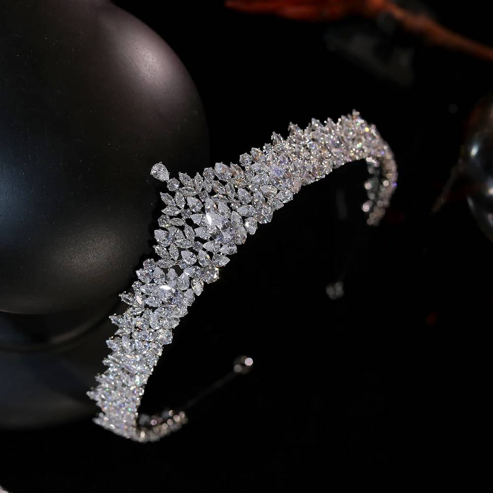 Close-up macro photograph highlighting the brilliant-cut marquise and pear shaped cubic zirconia gems on a bridal tiara crown.