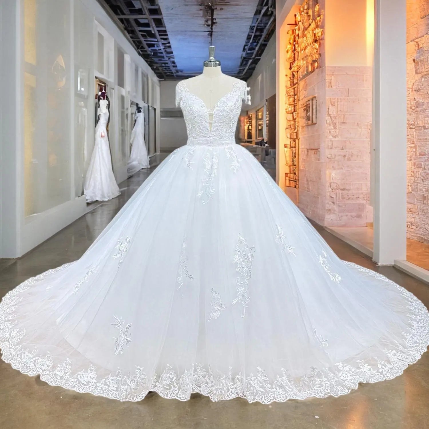 Showroom display of a white 2-piece mermaid wedding dress with a grand detachable chapel overskirt, showcasing intricate lace and sequin embroidery.