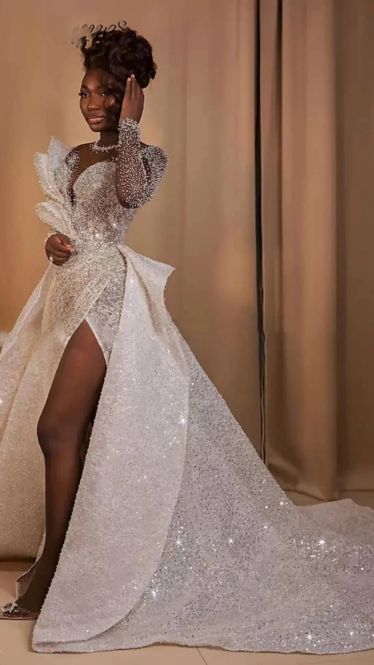 Side view of a glamorous plus size sequined bridal gown showcasing a high front thigh slit and a sweeping, floor-length detachable glitter overskirt train.