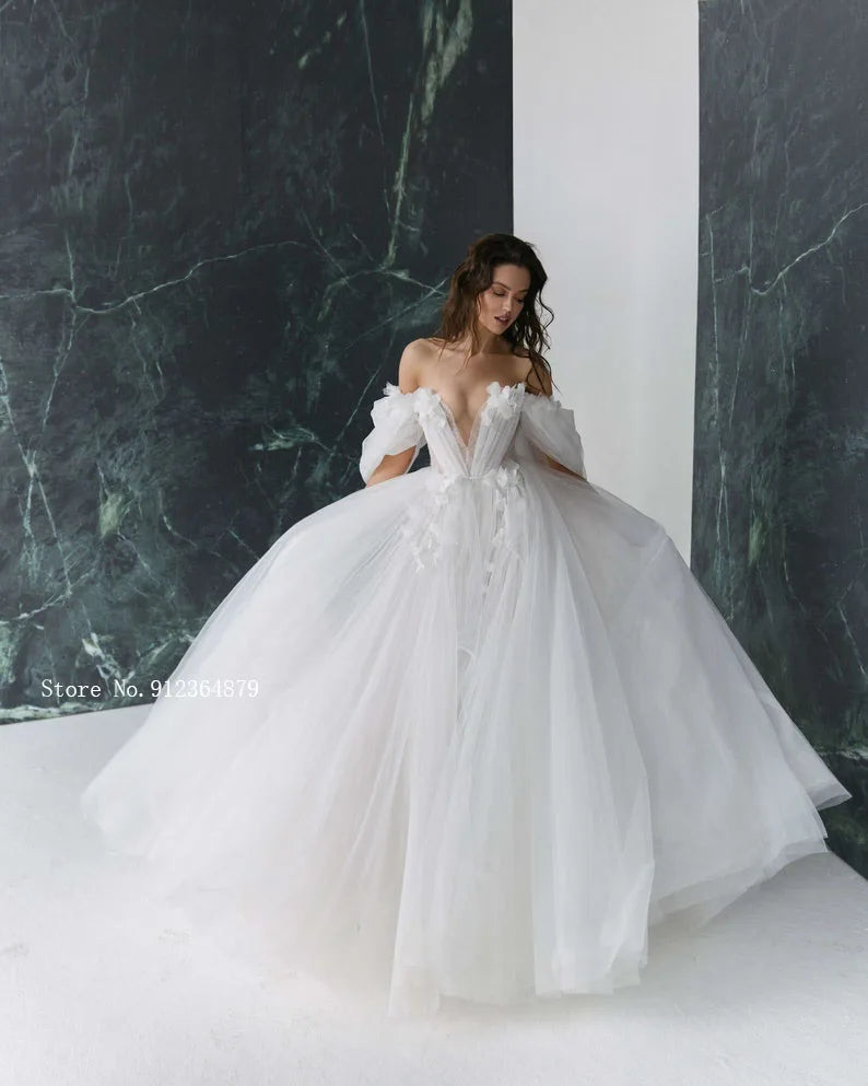 Full view of a princess ball gown wedding dress with a sweetheart neckline, featuring 3D flower appliques and optional detachable sleeves.