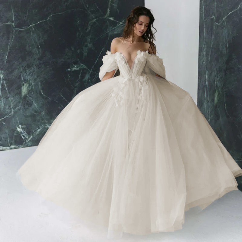 Sophisticated sweetheart wedding dress featuring dramatic 3D flower appliques and luxurious detachable sleeves.