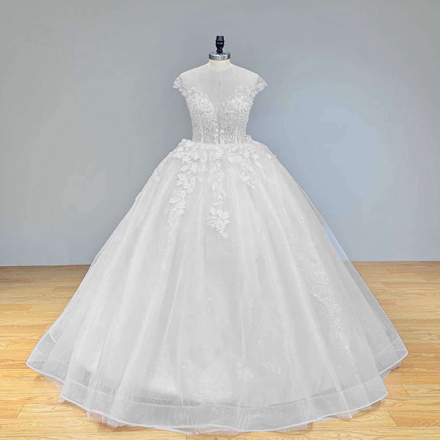 Elegant full front view of a luxury cap sleeve vintage wedding dress on a mannequin, highlighting the classic voluminous silhouette and exquisite 3D handmade flower overlays.