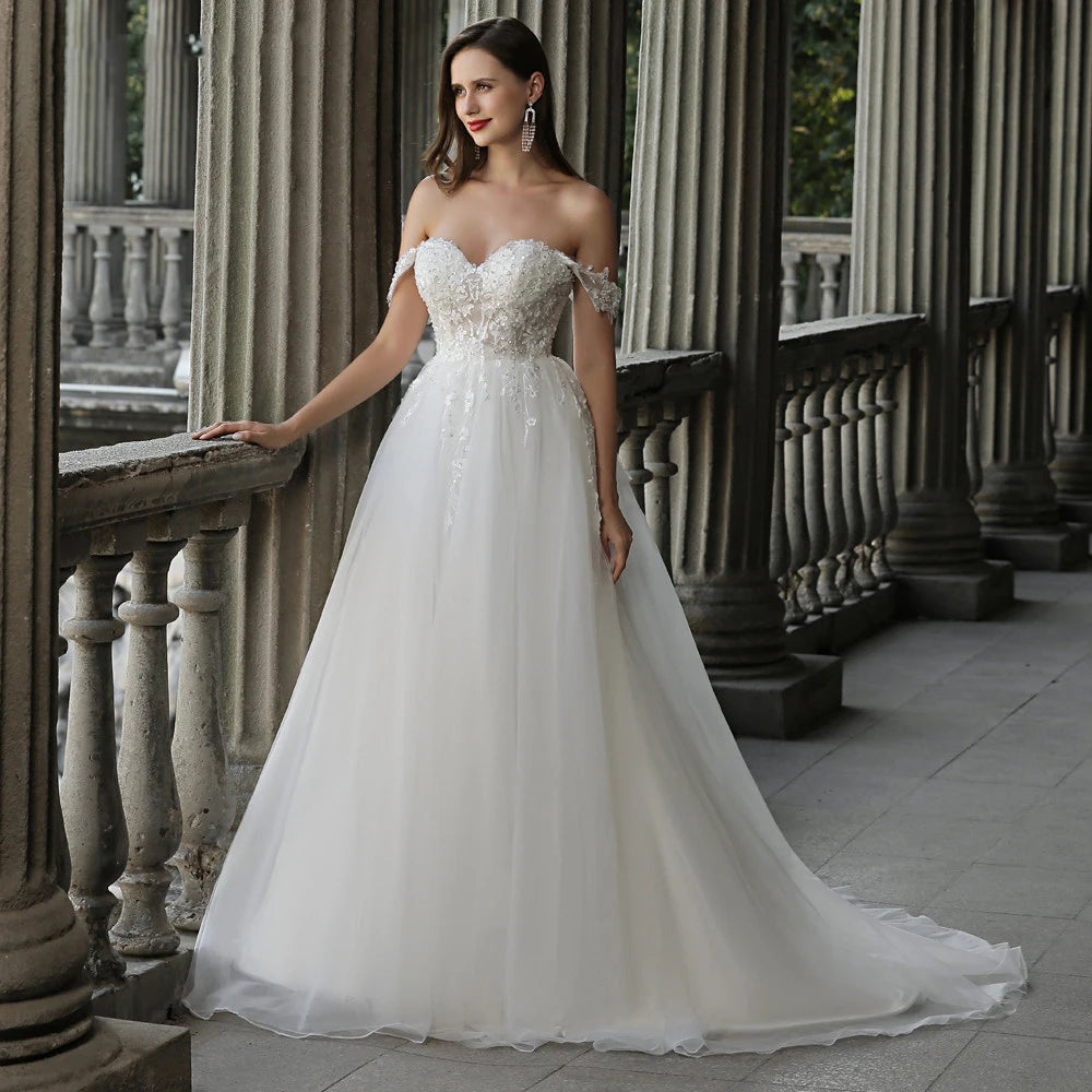 Full-length view of a modest A-line Muslim wedding dress with elaborate lace appliques, ideal for traditional bridal styling.