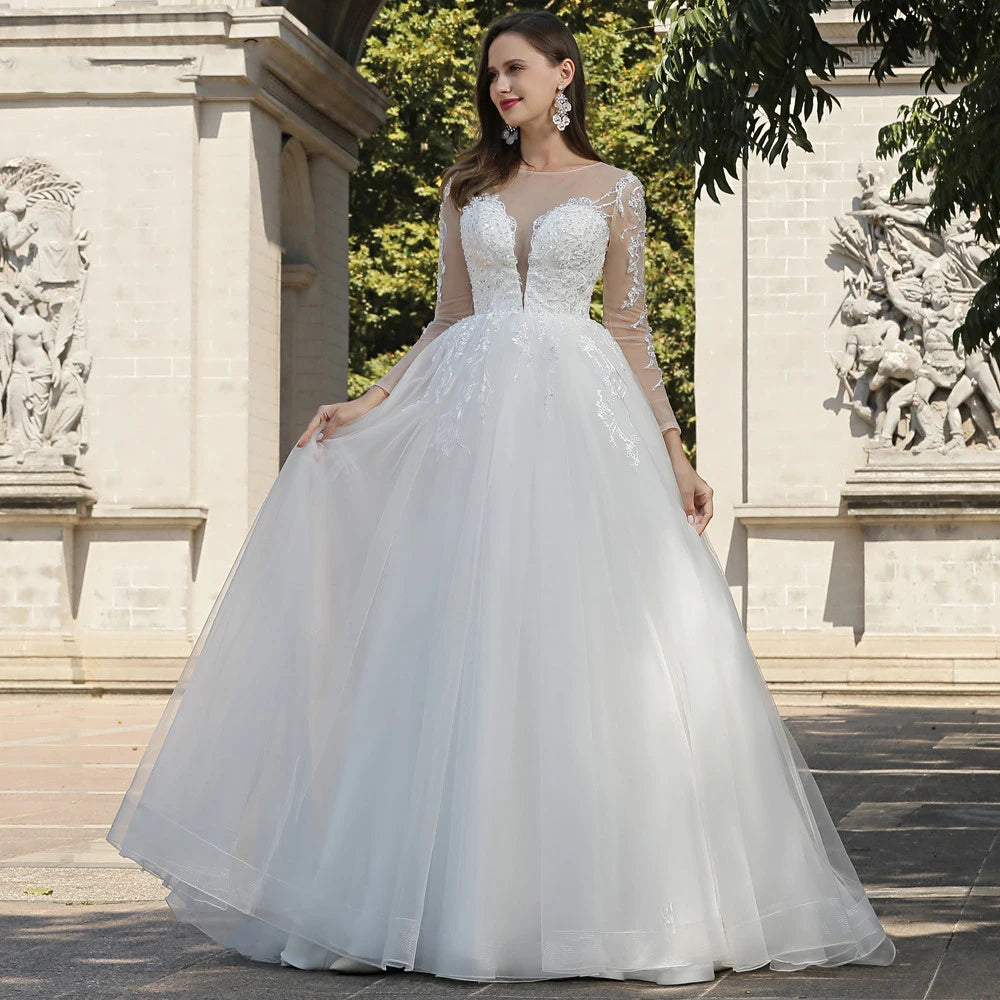 Portrait of a bride in a high-neck lace bridal gown with a tiara and veil, emphasizing modest and traditional wedding fashion.