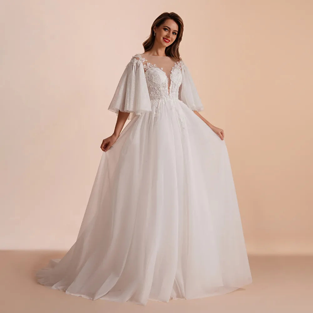 Elegant Muslim bride holding a bouquet, wearing a high-neck lace long-sleeve wedding dress in a bright, modern setting.