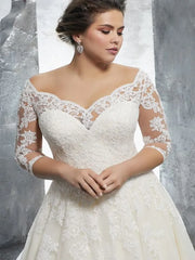 Elegant plus-size A-line wedding dress featuring an off-shoulder neckline, delicate lace sleeves, and intricate floral appliques.