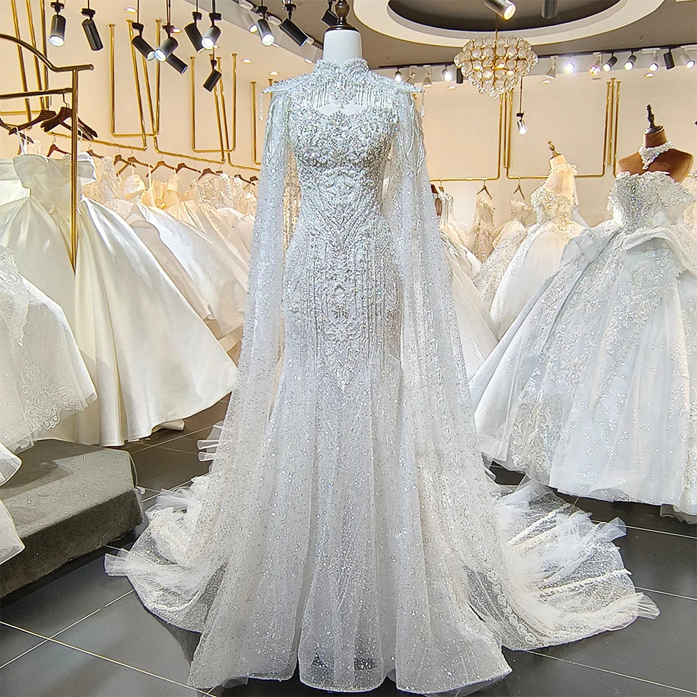 Front display of a sparkling A-line sequin lace wedding dress on a mannequin, highlighting the detailed floral lace appliques and V-neckline.