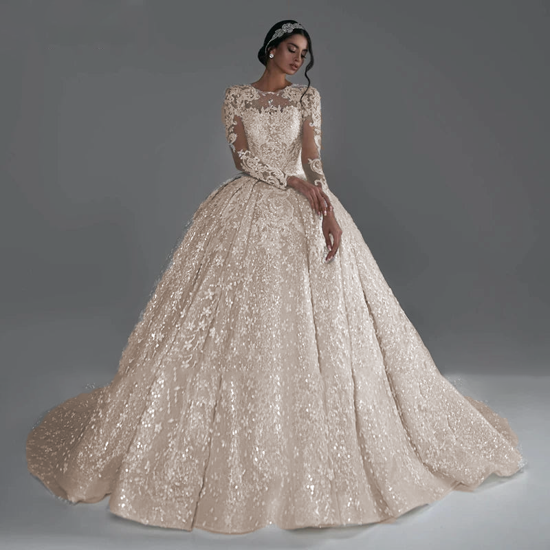 A full-length portrait of a bride in the AmyLvager 2024 ball gown, highlighting the regal silhouette and luxury beaded embellishments.