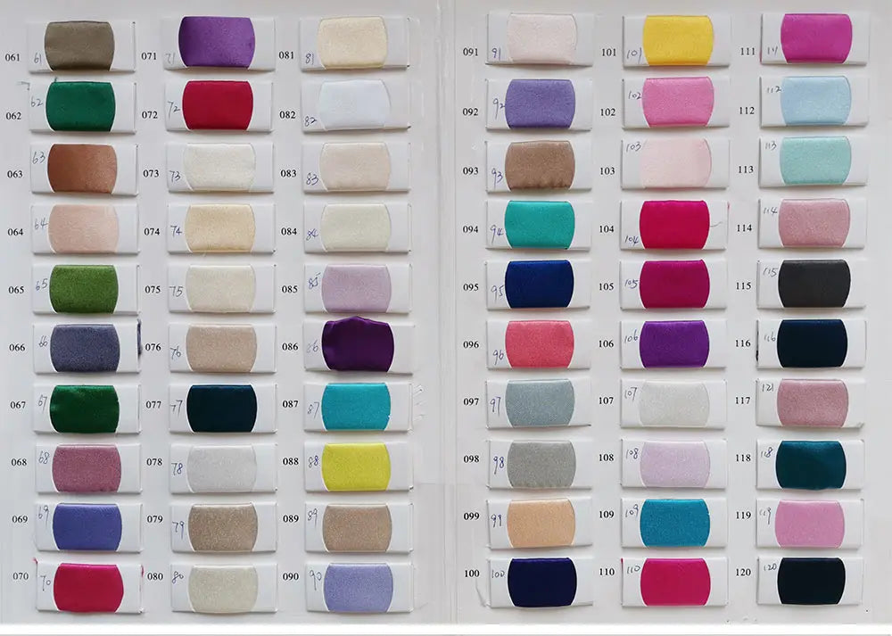 A color swatch book displaying the various fabric and color options available for this luxury bridal gown.