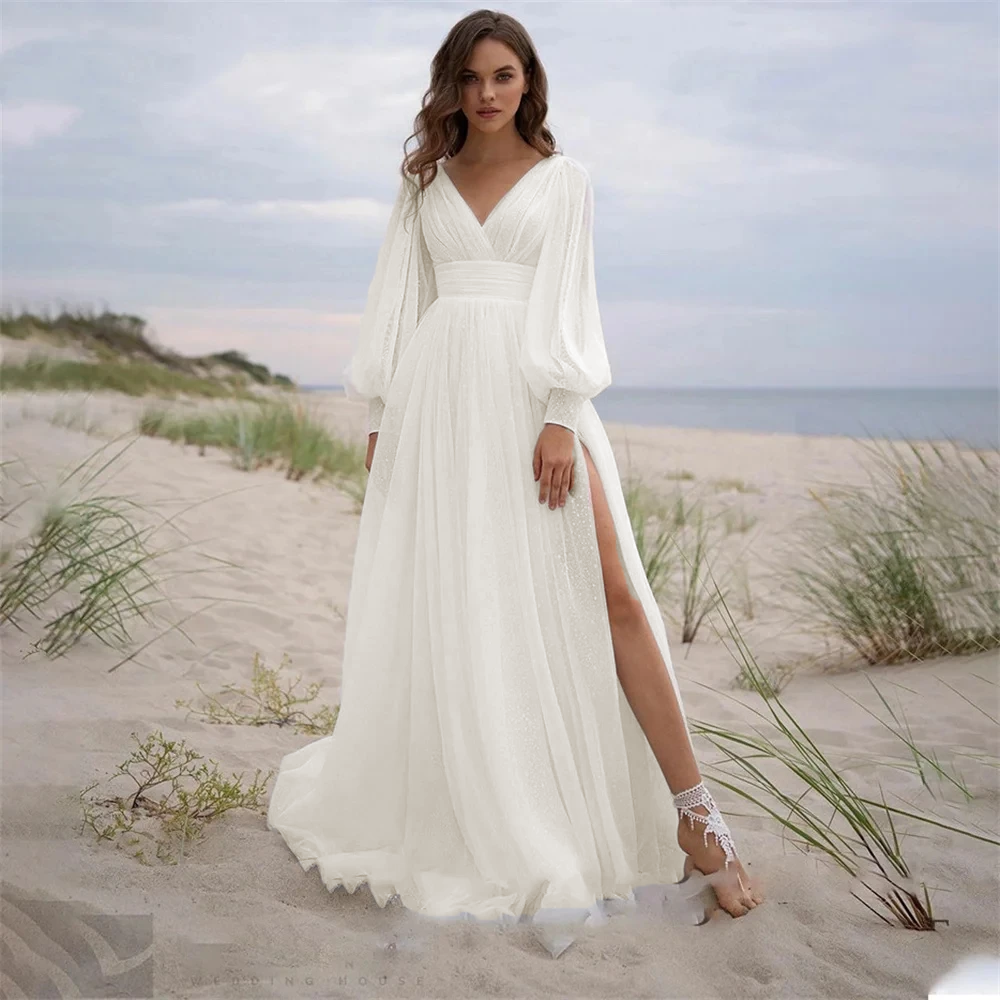 Full-length view of a BOHO vintage wedding dress with long puff sleeves and a simple, elegant tulle silhouette ideal for bohemian brides.