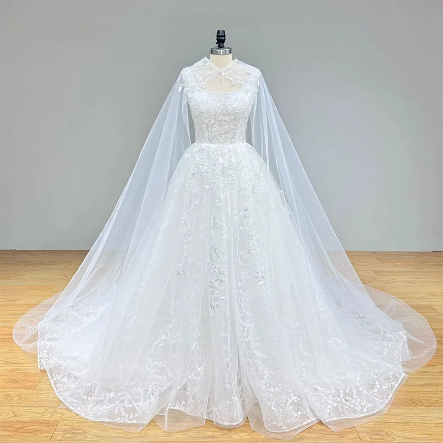 Full front perspective of the sequined bridal gown on a mannequin, illustrating the floor-length silhouette and the delicate keyhole detail of the high-neck cape.
