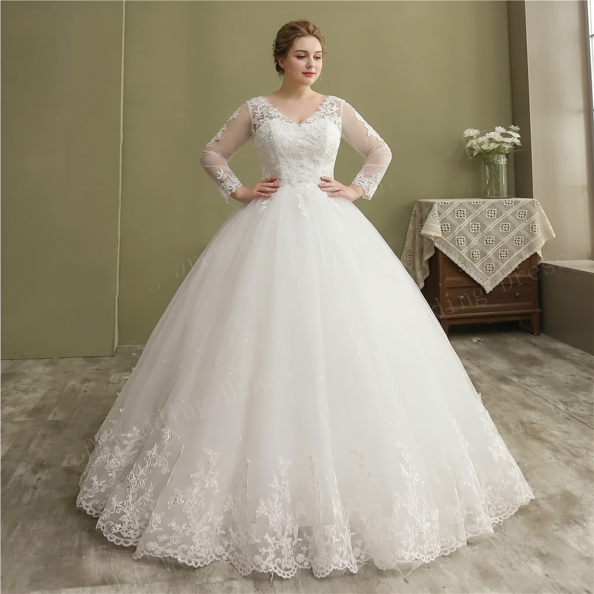 Rear three-quarter view of the vintage lace ball gown bridal dress, showcasing an intricate illusion lace back with button closures and a sweeping cathedral train.