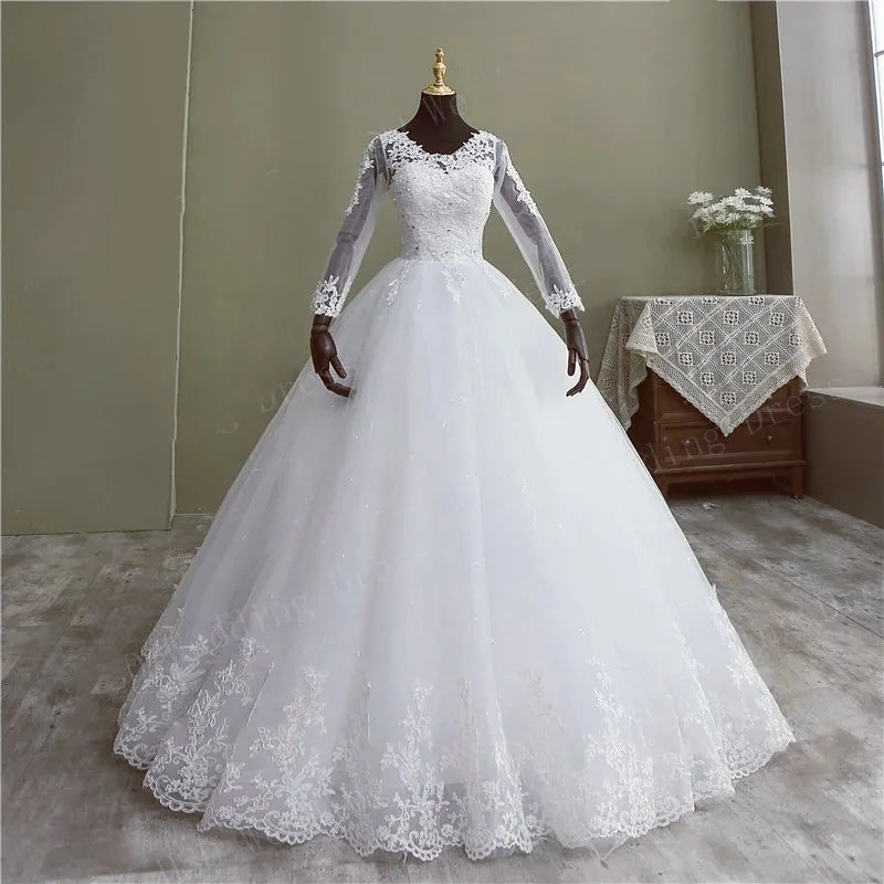 Elegant front portrait of the floral lace ball gown bridal dress, showcased in a sophisticated warm champagne or light ivory variant under studio lighting.
