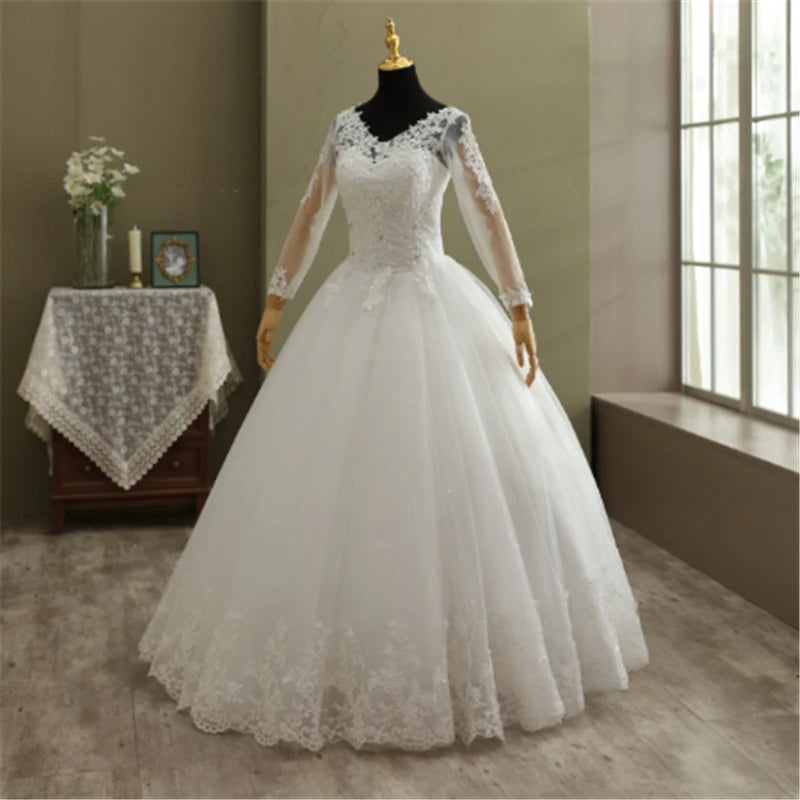 High-resolution full silhouette profile view of the vintage long sleeve lace ball gown wedding dress, accentuating the dramatic layered fullness of the A-line tulle skirt.