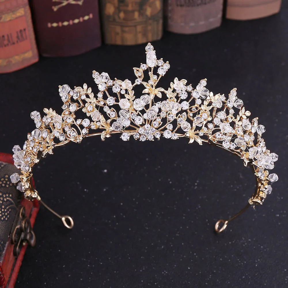 Elegant gold baroque bridal tiara featuring intricate handmade beading and crystal details.