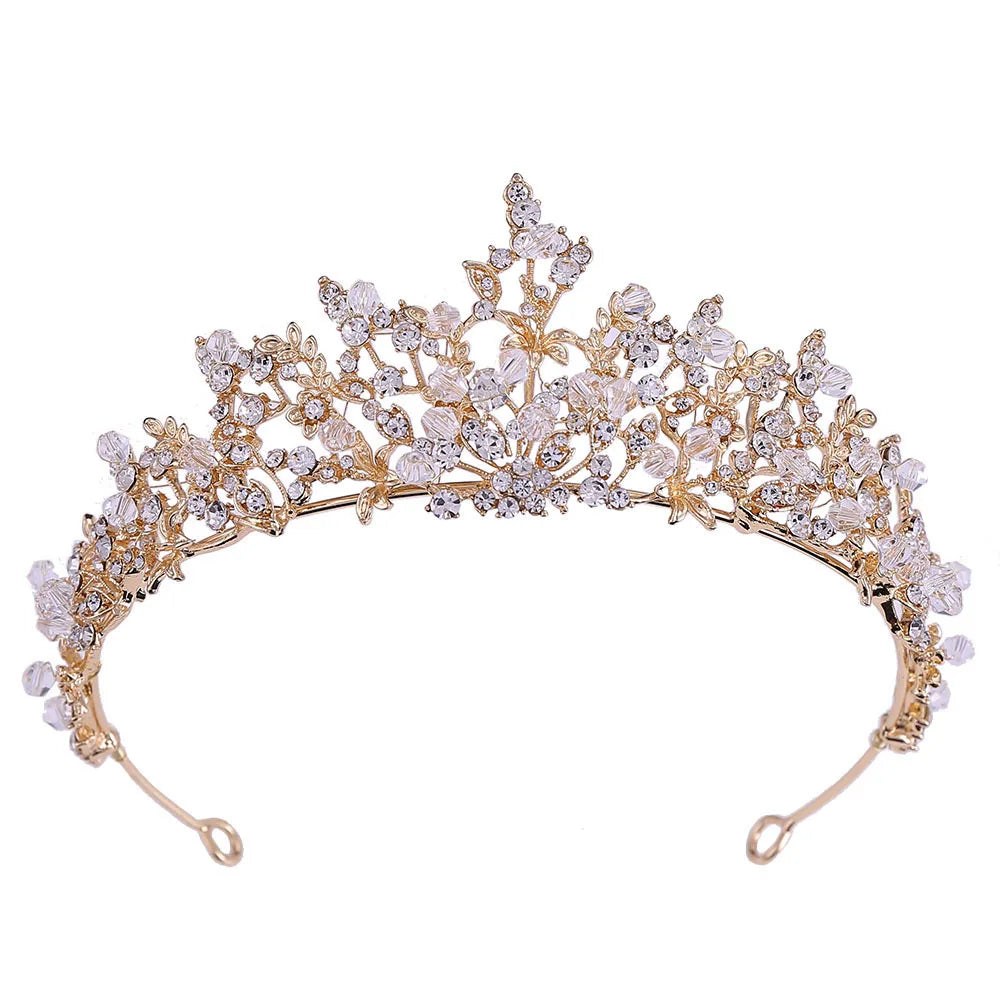 Close-up of a gold baroque crystal tiara for weddings and special occasions.
