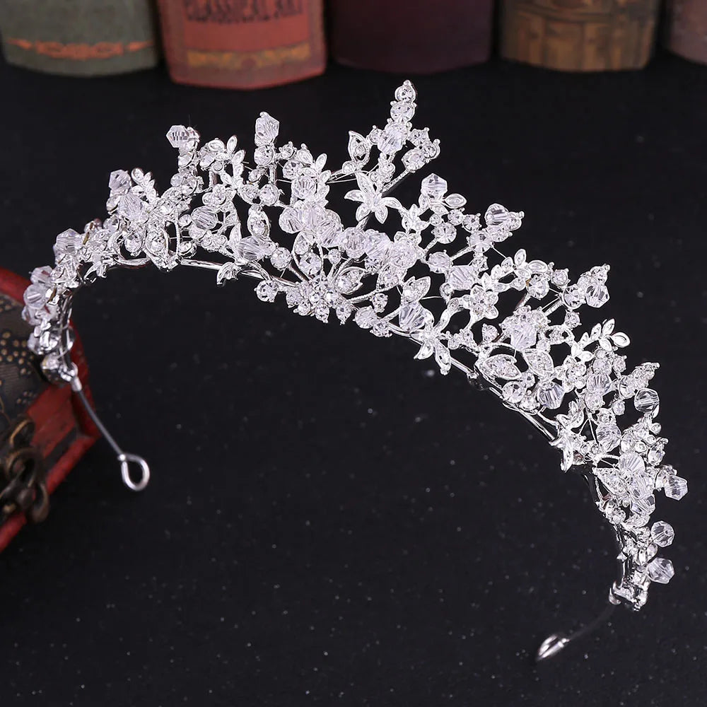 Detailed view of a silver handmade crystal wedding tiara with ornate beadwork.