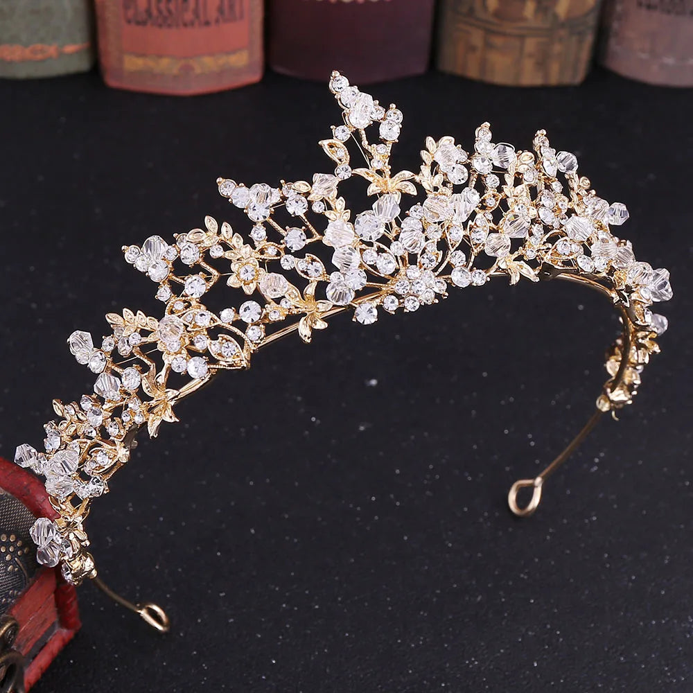 Elegant gold-toned baroque crown designed as a luxury bridal hair accessory.