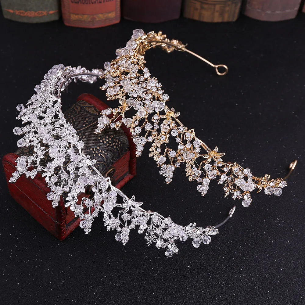 Side-by-side display of silver and gold baroque bridal tiaras for wedding hair styling.