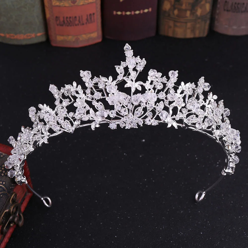 Ornate silver crystal bridal tiara, perfect for a vintage-inspired wedding look.