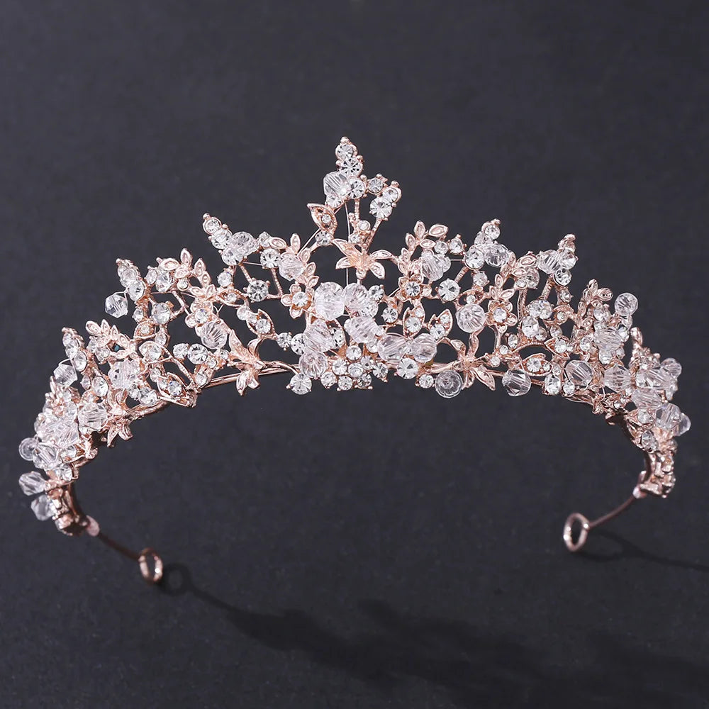 A luxury rose-gold handmade bridal tiara featuring intricate floral crystal beadwork.