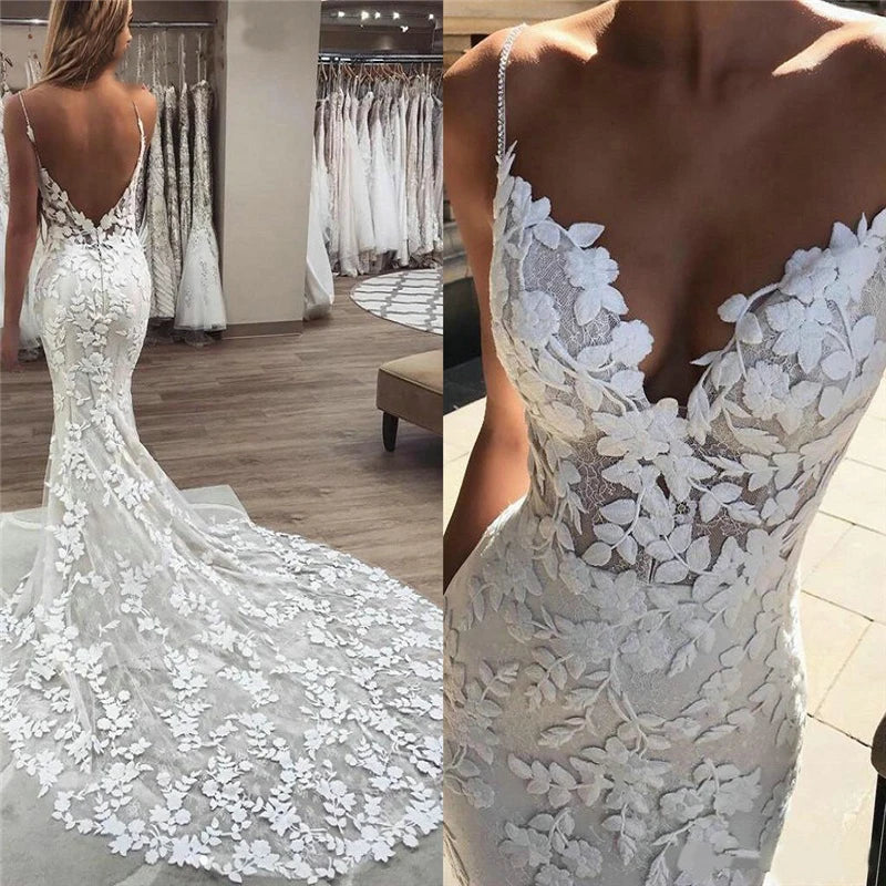 A bride wearing a boho-style mermaid wedding dress with intricate floral lace appliqués, delicate spaghetti straps, and a stunning backless design.
