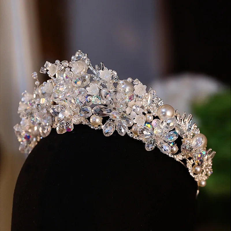 Close-up detail of high-quality crystal and pearl wedding tiara featuring intricate floral accents