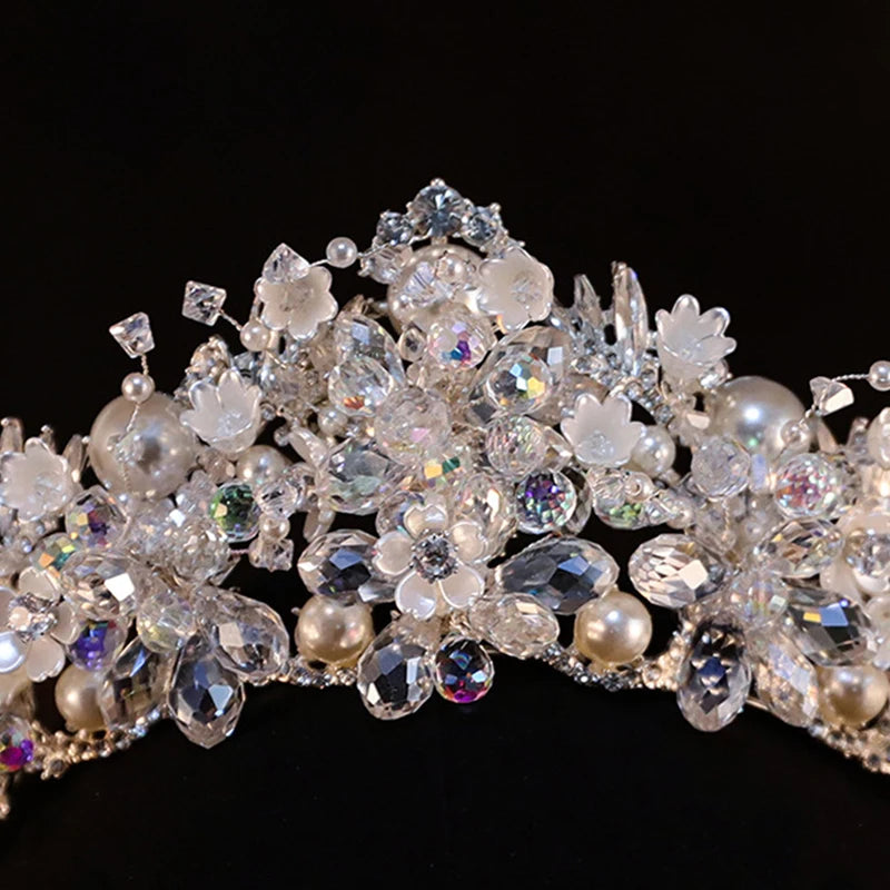 Detailed view of sparkling rhinestone and pearl bridal tiara crown for wedding hair accessories