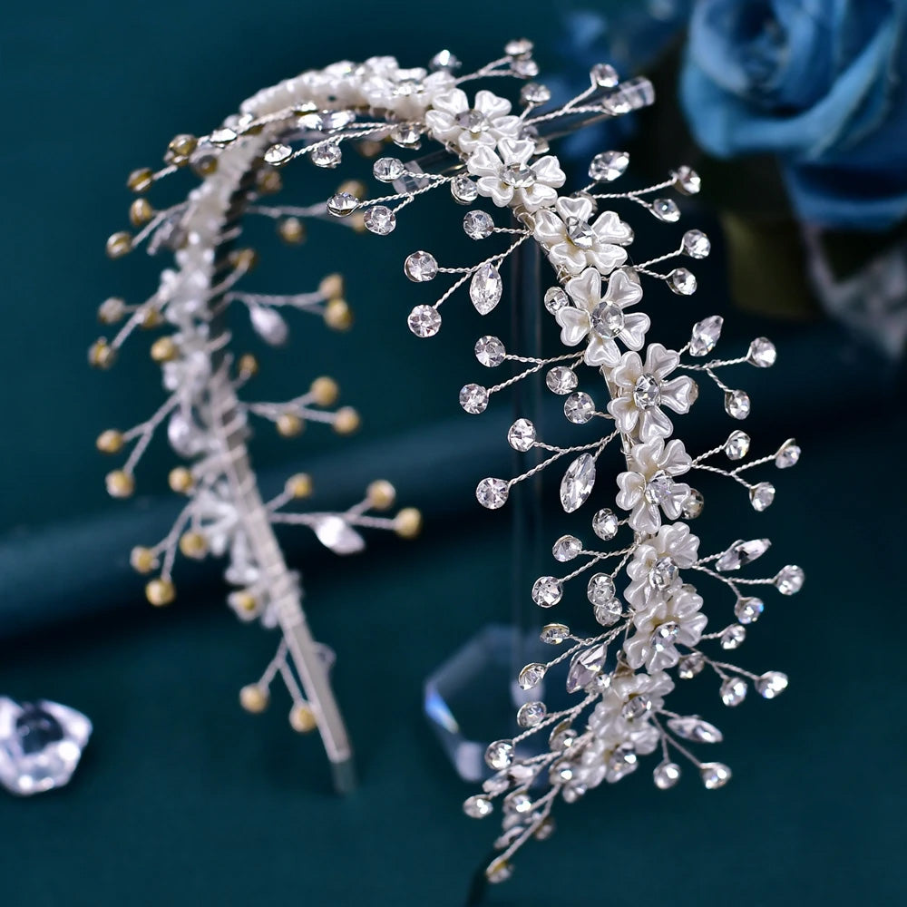 Close-up shot of a silver wedding hair accessory showcasing intricate floral wire work and shimmering marquise-cut rhinestones.