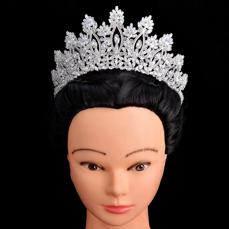 A mannequin head displaying an elegant silver crystal bridal tiara for women.