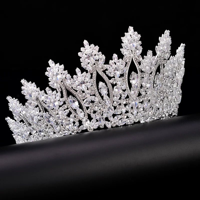 A gold-toned bridal tiara and wedding crown featuring sparkling crystal accents.
