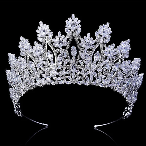 Reflection of an elegant crystal bridal tiara on a black display surface.