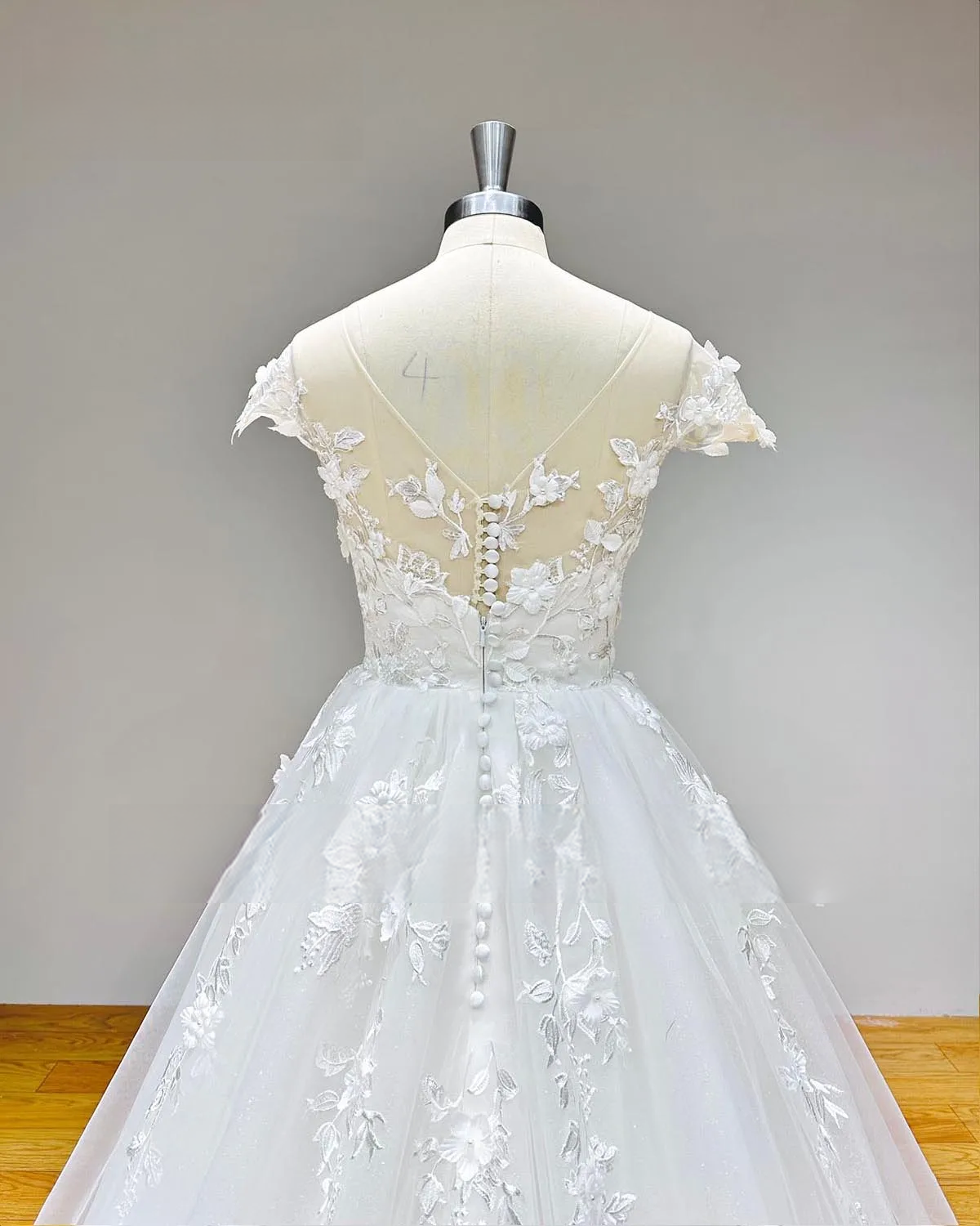 Cap Sleeve A-Line Wedding Dress with Pearls Appliques and Button Back