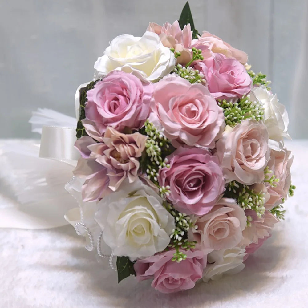 A colorful wedding anniversary bouquet composed of artificial roses in shades of dusty pink, white, and cream.