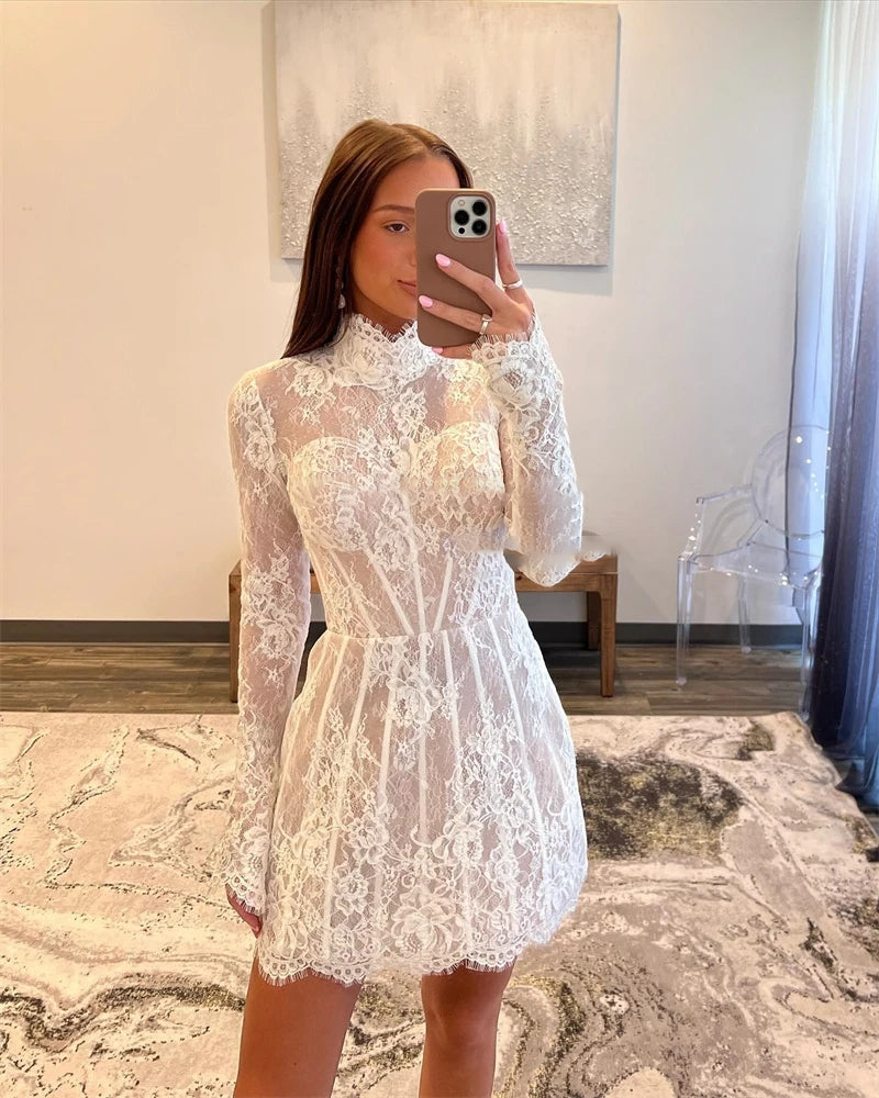 Elegant short lace wedding dress featuring a high neck, long sleeves, and a structured corset-style bodice with a flared mini skirt.