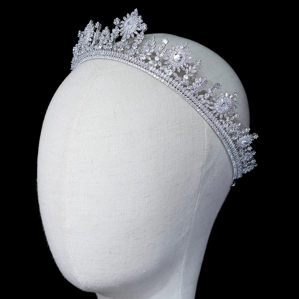 Side-profile view of a silver cubic zirconia bridal crown hair accessory displayed on a mannequin head.