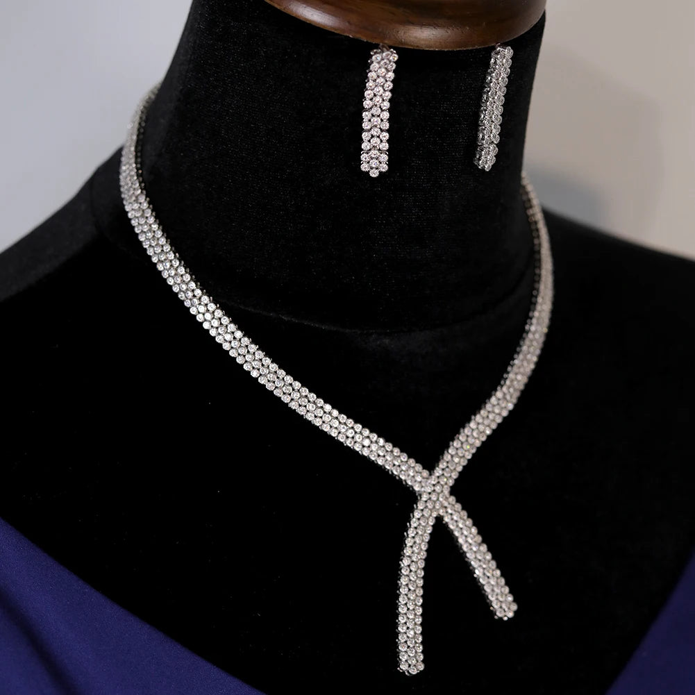 Perspective look highlighting the brilliant, shimmering pave settings of the luxury 2pcs wedding necklace and earrings collection.
