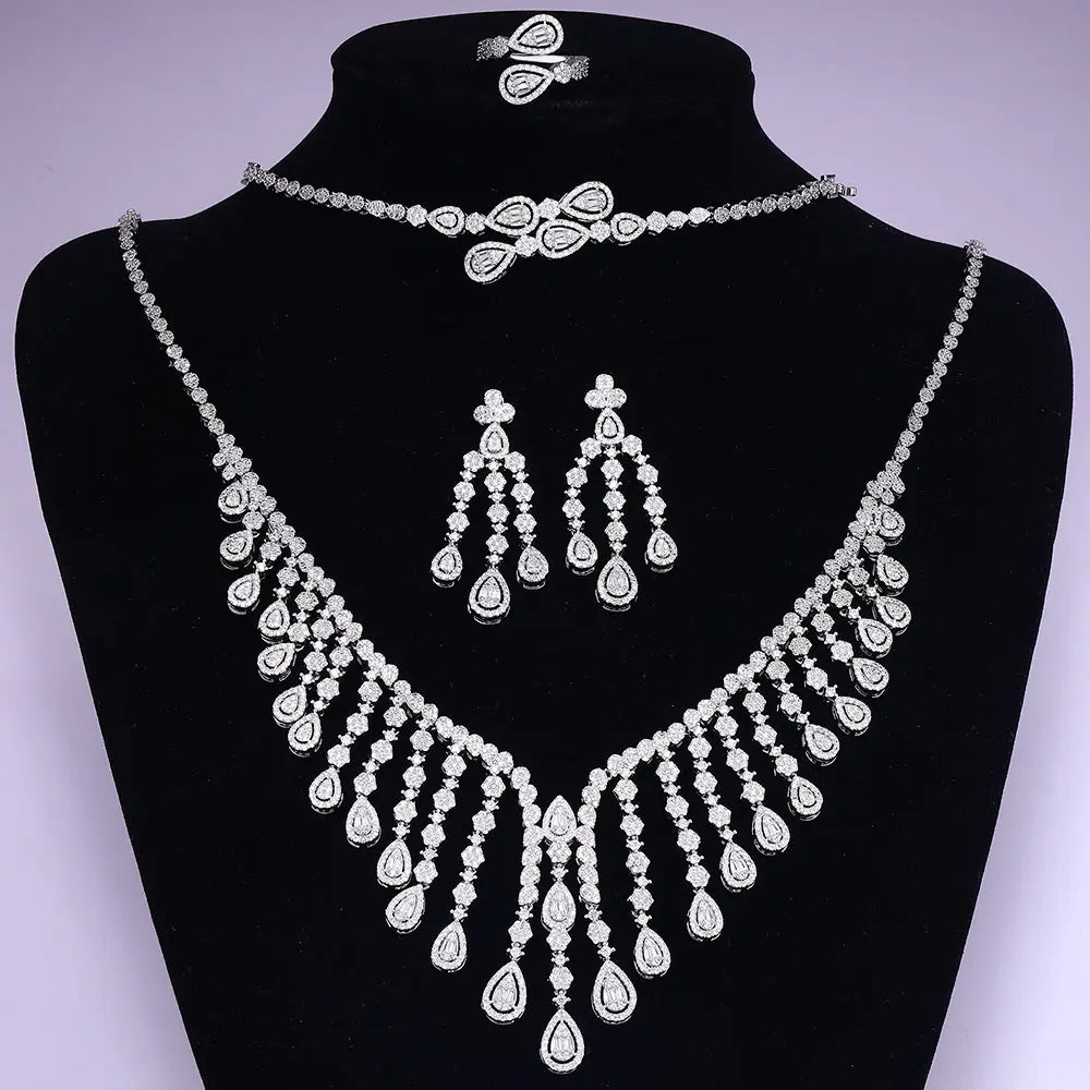 Direct front view of the complete 4-piece Nigerian wedding jewelry set elegantly arranged on a sleek black velvet mannequin display bust.