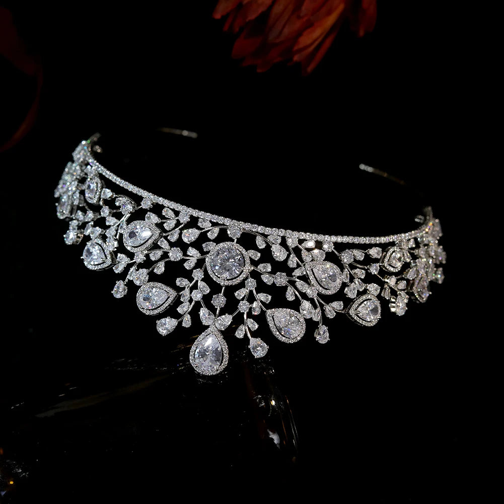 Upside-down display view of the inner band structure and hanging crystal droplets of an elegant rhinestone wedding crown.