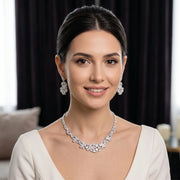 Model wearing a cubic zirconia choker necklace and matching leaf-design dropdown earrings for a bridal wedding look.