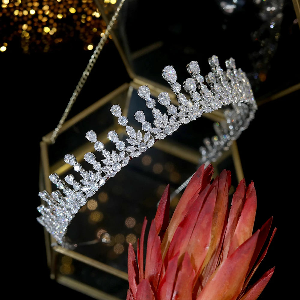 Detailed macro shot of a silver cubic zirconia wedding hair accessory headband on a gold geometric stand