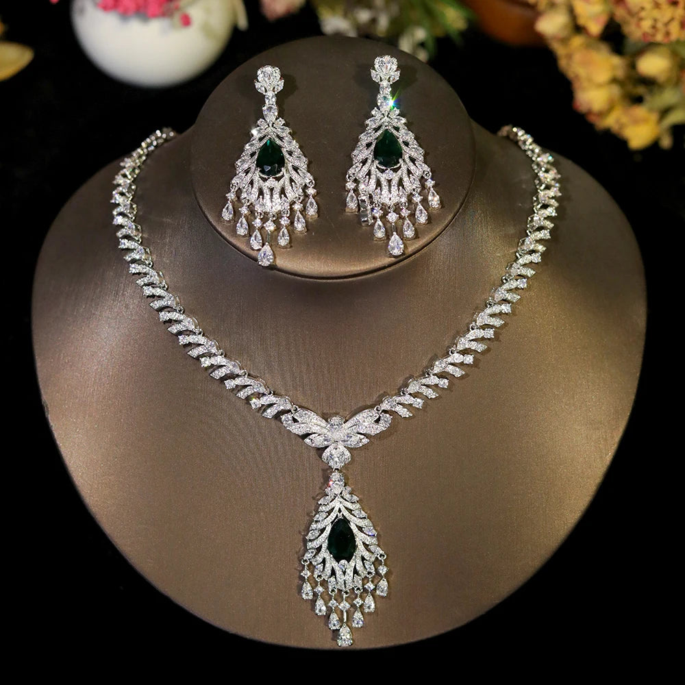 Glamorous crystal bridal necklace and dangle tassel earring set with emerald green gemstone highlights