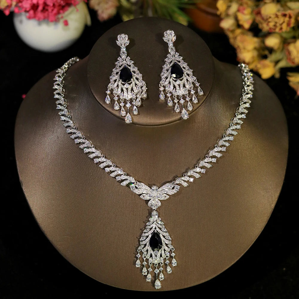 Elegant rhinestone wedding jewelry set with sapphire blue crystals and statement dangle tassel details