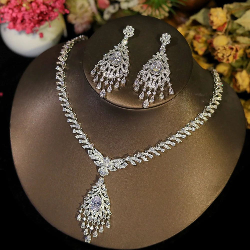Close-up shot of a magnificent silver rhinestone dangle tassel necklace and earring set for weddings and parties