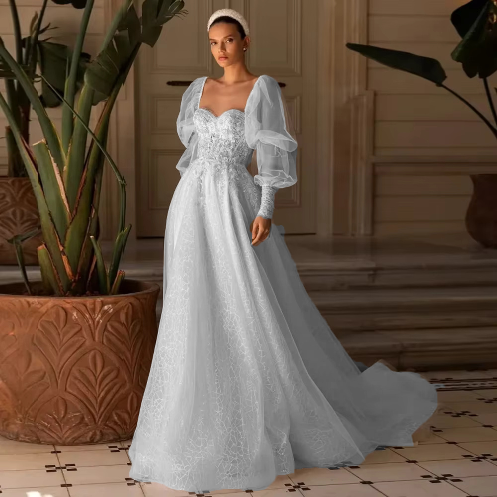 Full front view of the detachable long sleeve tulle wedding dress digitally edited in a cool-toned silver or light blue color variation for alternative bridal styles.