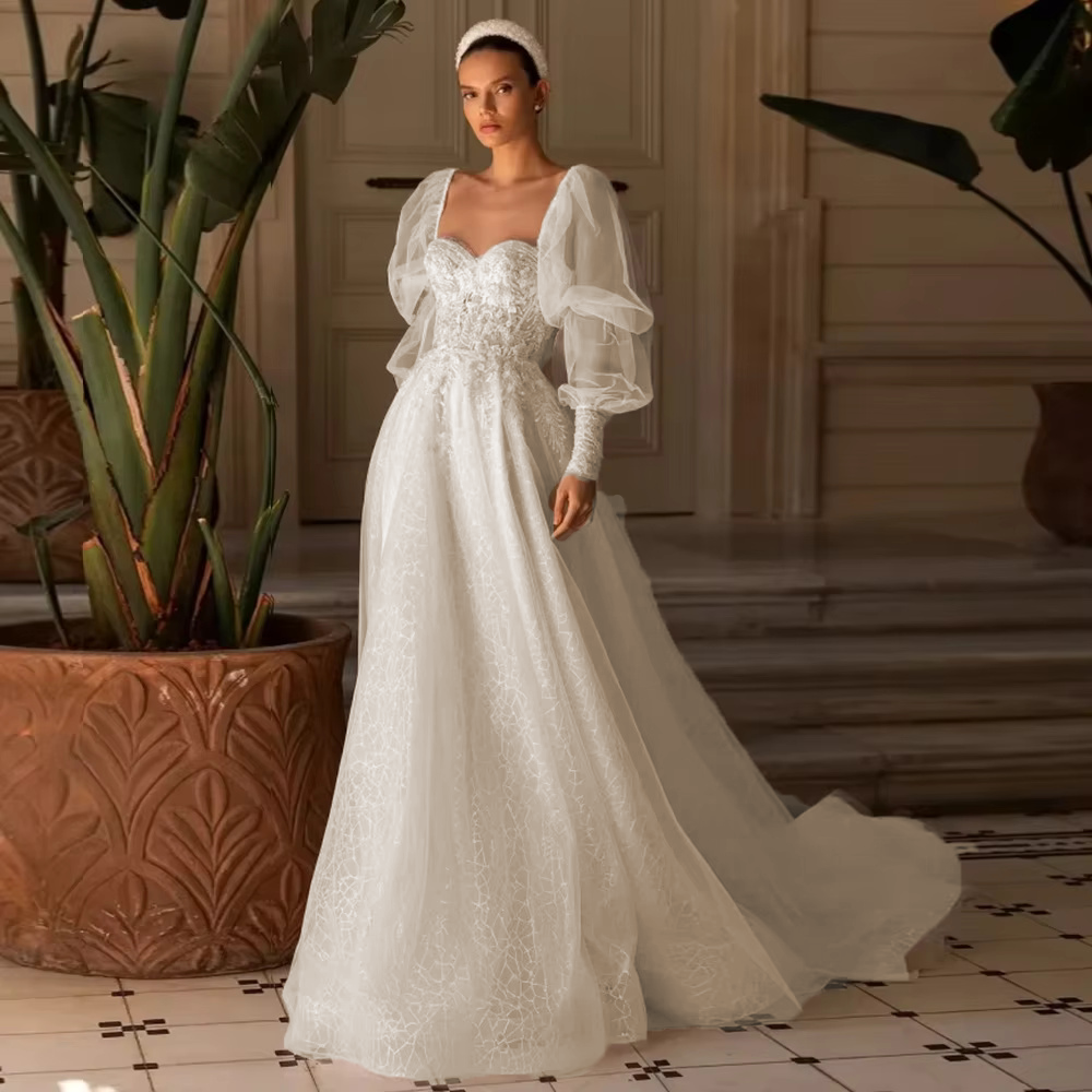 Full-length display of the sweetheart neck beaded applique gown rendered in a warm ivory or soft champagne tint option for a classic bridal aesthetic.