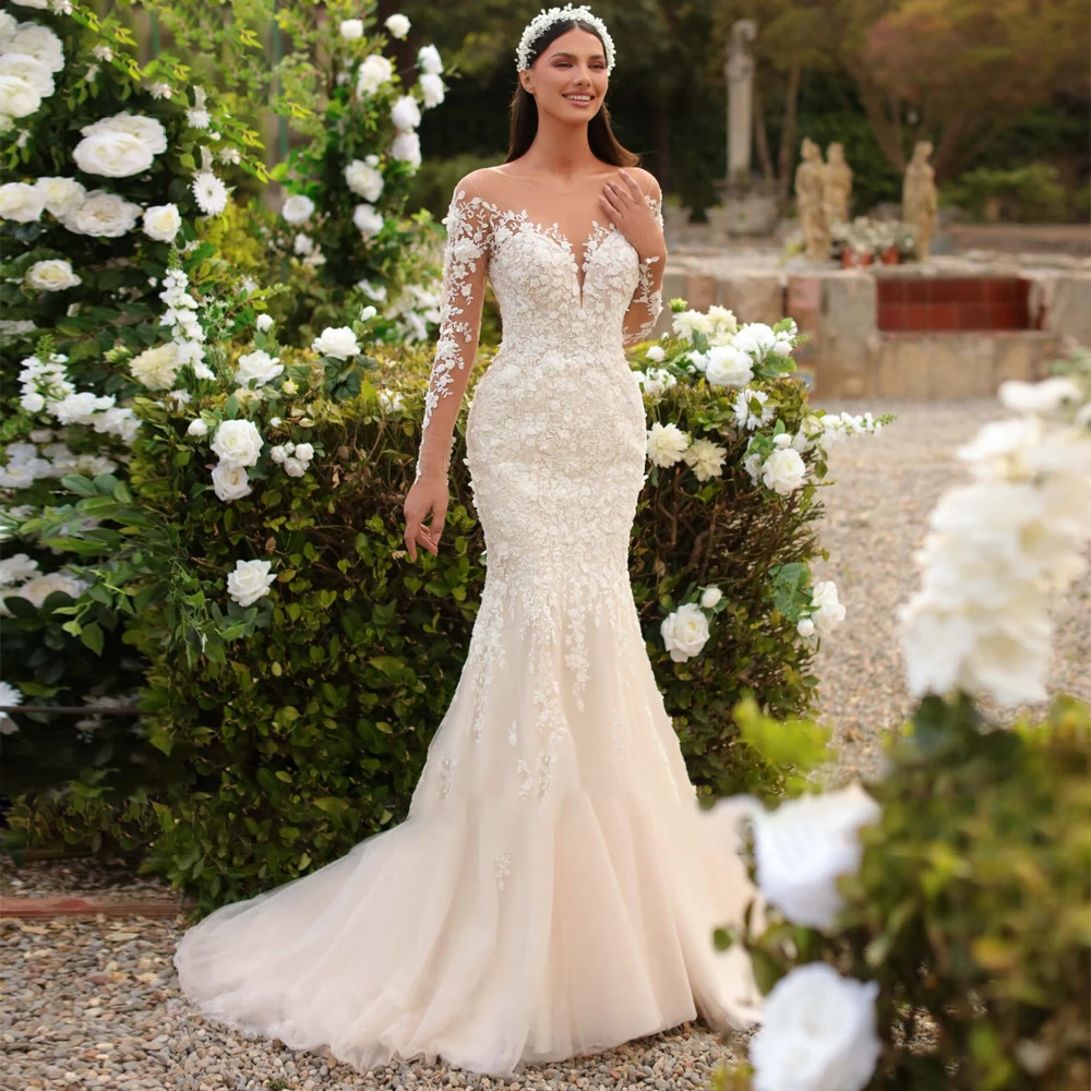 A stunning mermaid wedding dress with lace appliques and a detachable train, captured in an elegant outdoor garden environment.