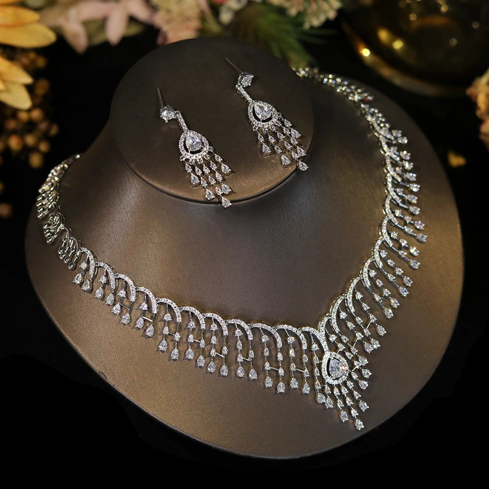 Side-angle display of a luxury white CZ tassel wedding necklace set showcasing detailed fringe drapery.