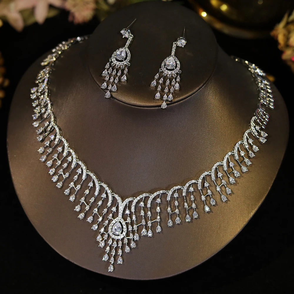Premium cubic zirconia bridal jewelry set featuring an elaborate chandelier tassel necklace and matching drop earrings.